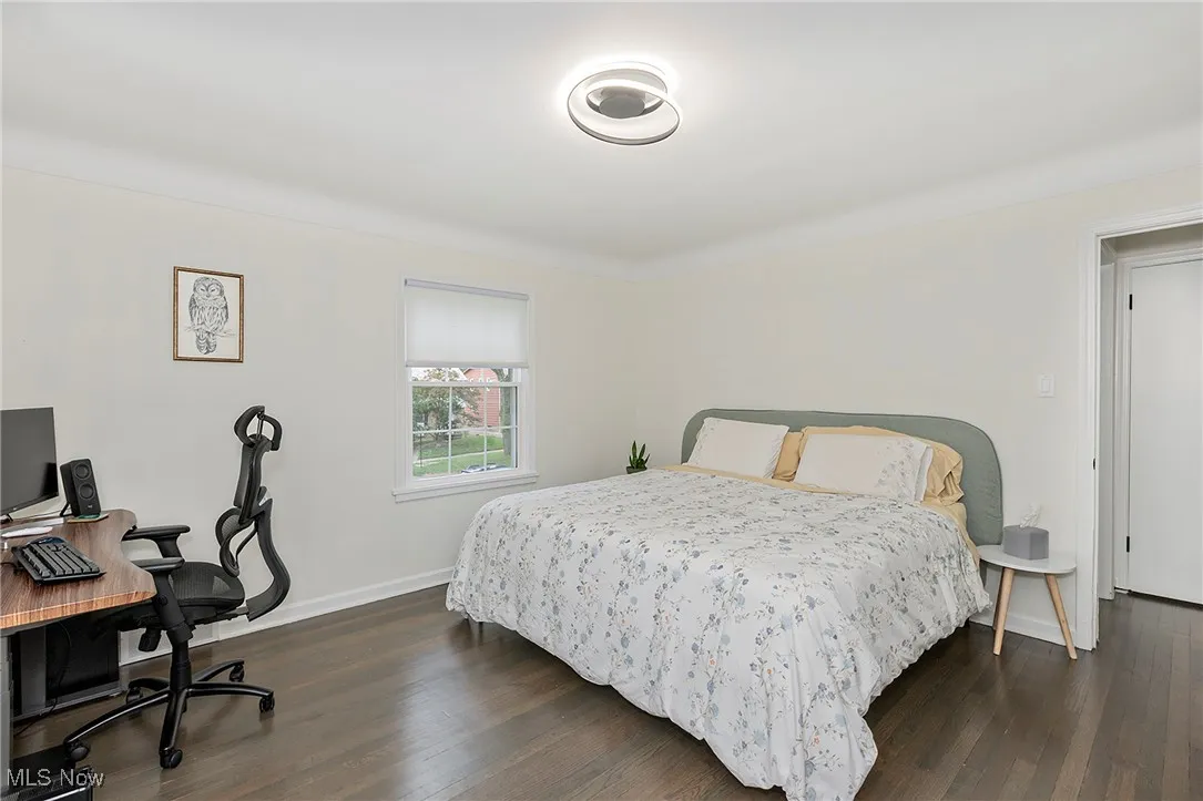 The second bedroom is spacious, providing ample room for both sleeping and working.