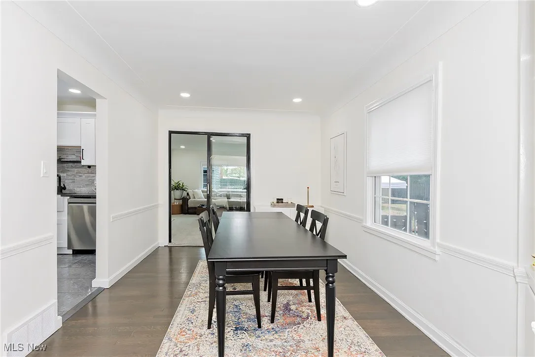 The dining area opens to the living room and the family room.