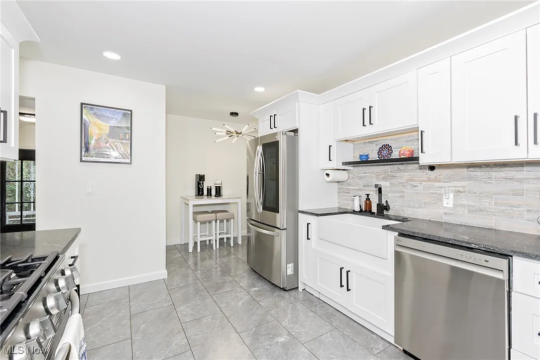 Enjoy cooking in this gourmet kitchen with farmers deep sink and stainless steel appliances.