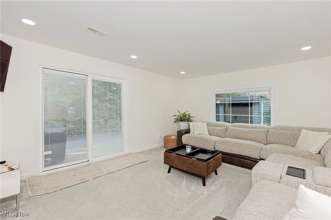 The family room walks out to a patio, an essential living space.