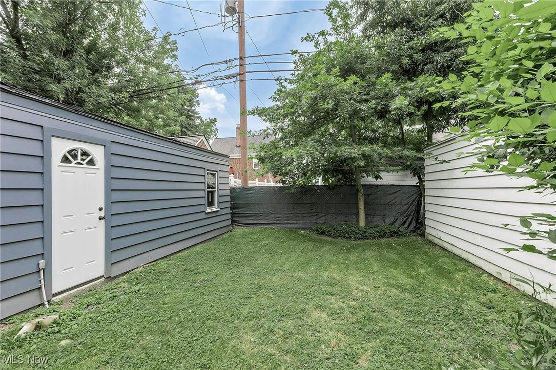 The garage on the left includes a person door entry + newer gutters.