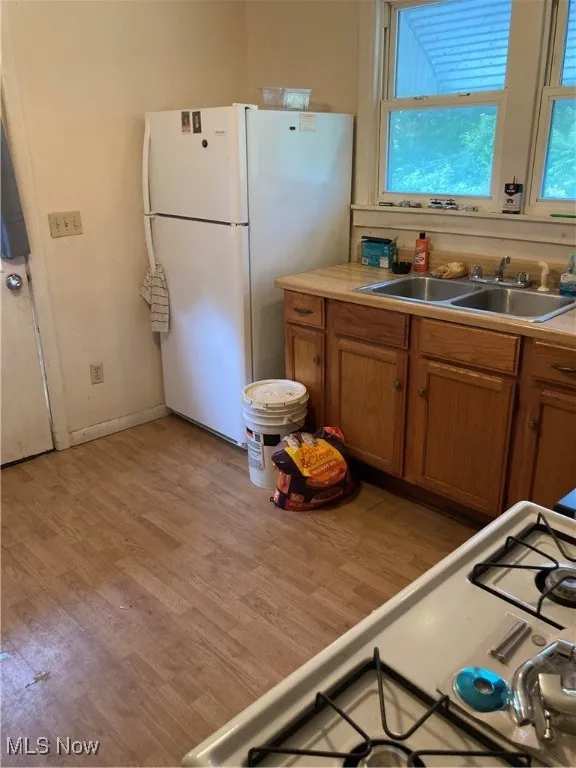 Kitchen with brown cabinets