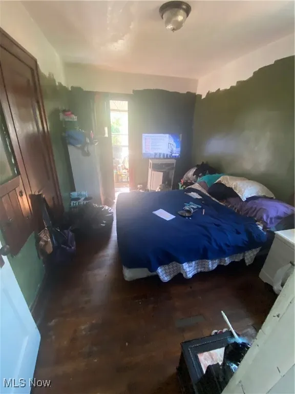 Bedroom with wood finished floors