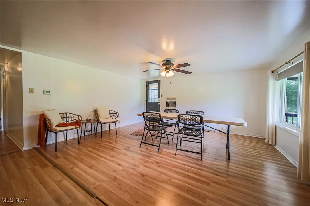 Dining space featuring healthy amount of natural light and wood finished floors