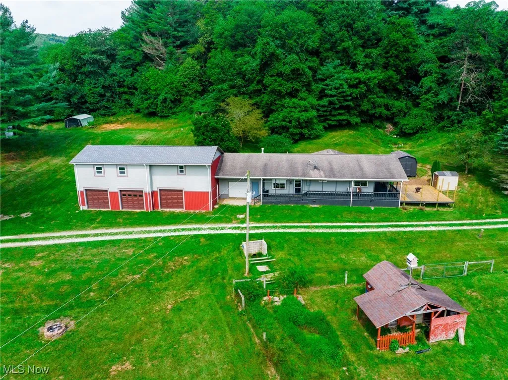 View from above of property with a heavily wooded area