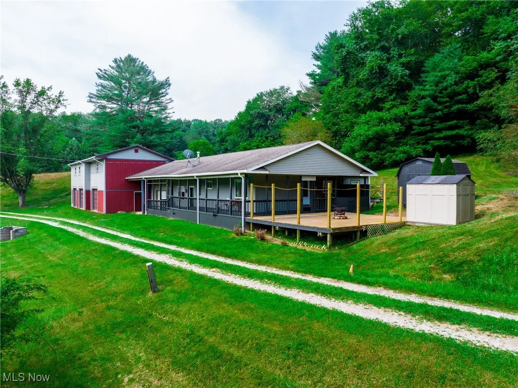 Wooden deck with a storage shed and a fire pit
