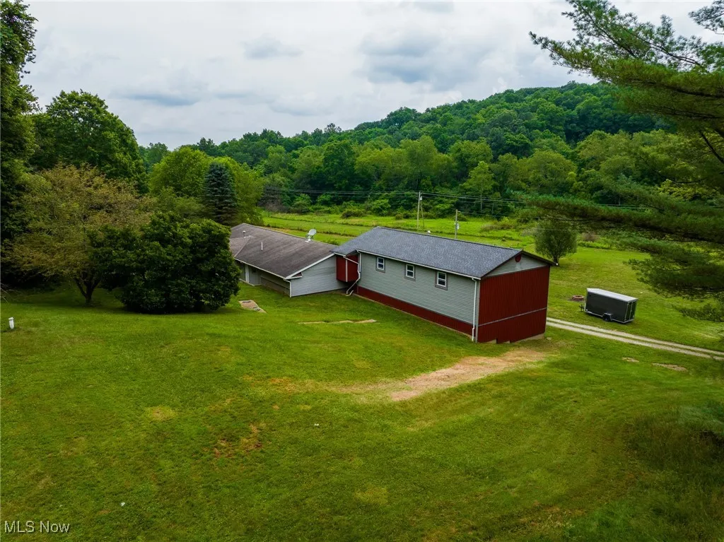 View from above of property with a forest