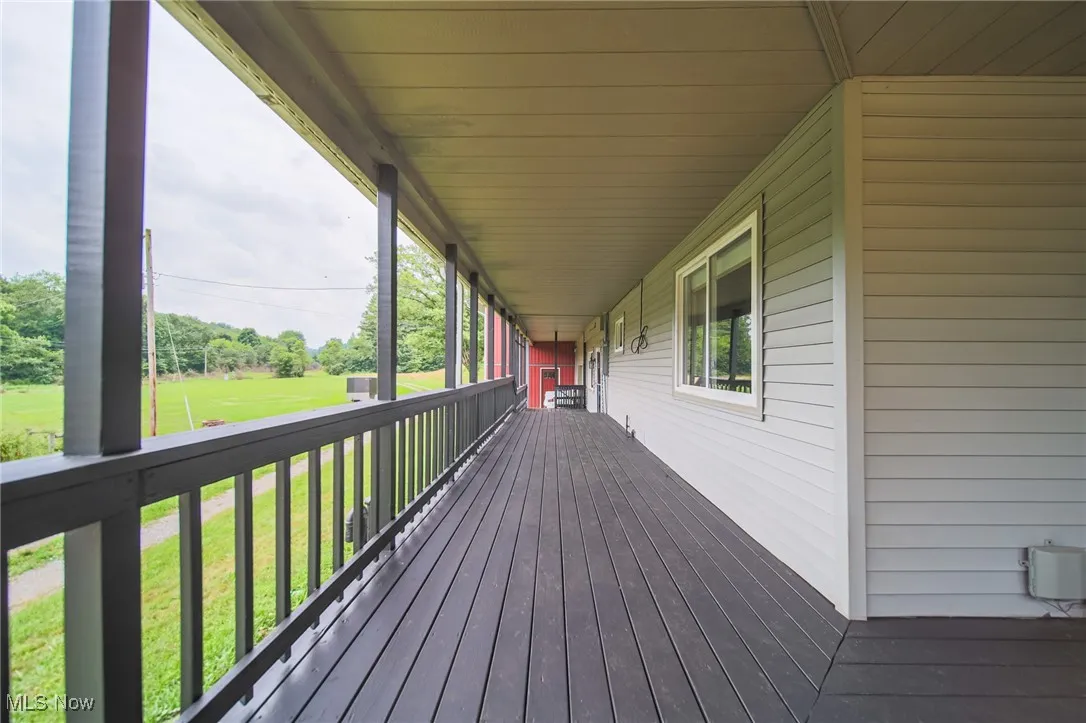 Wooden deck featuring a yard