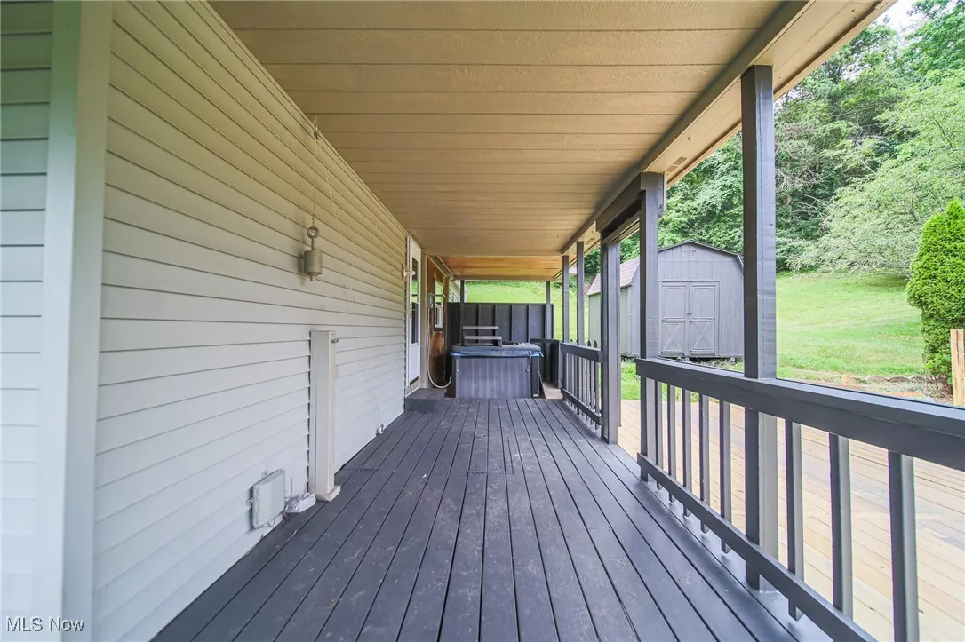 Deck with a storage shed