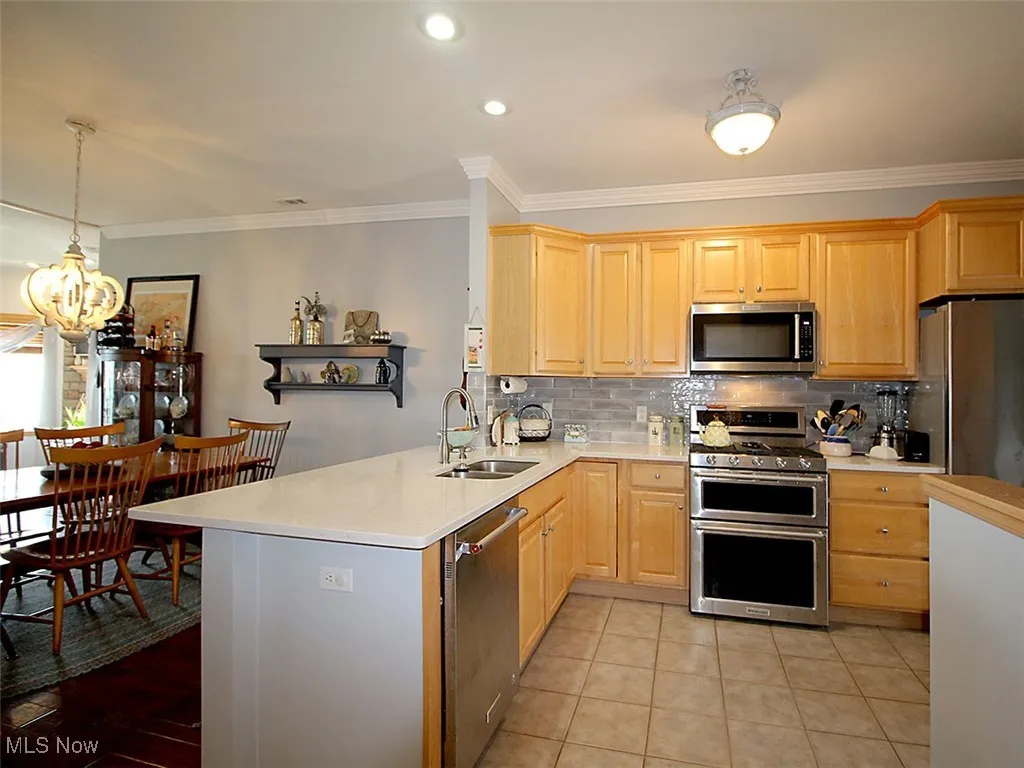 Open concept kitchen, dining area with views of lake