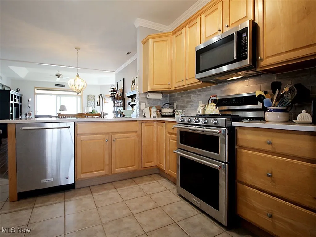 Kitchen with breakfast bar facing lakeside views