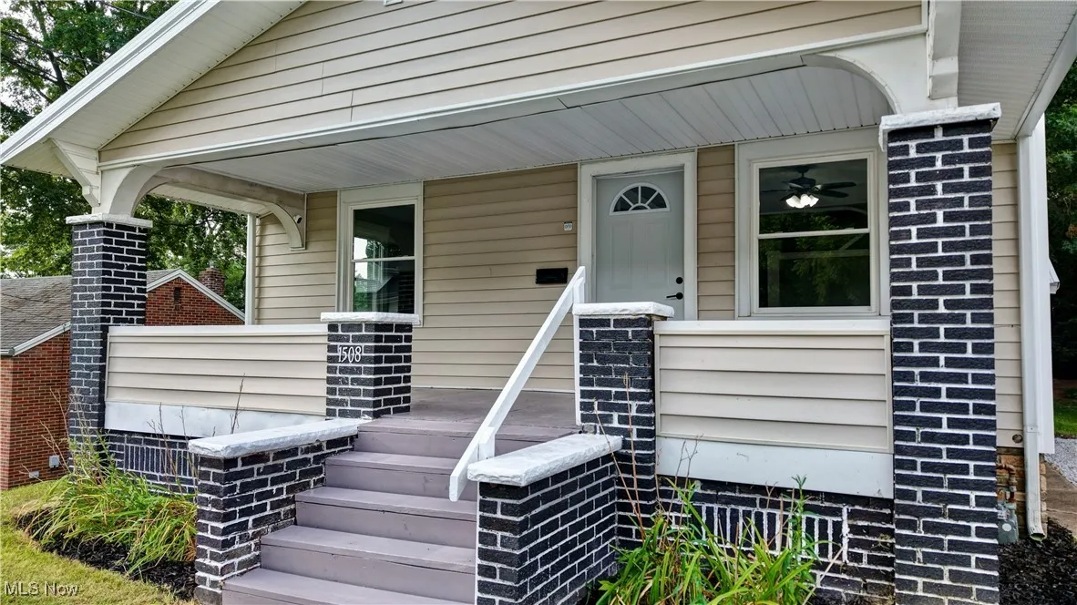 Doorway to property with covered porch