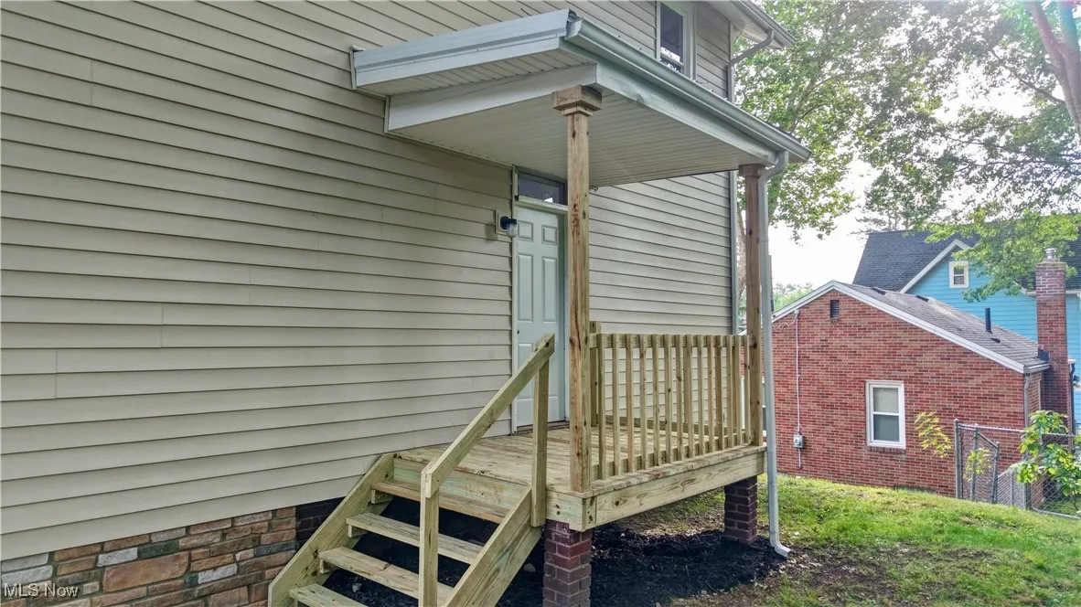 Doorway to property with a deck
