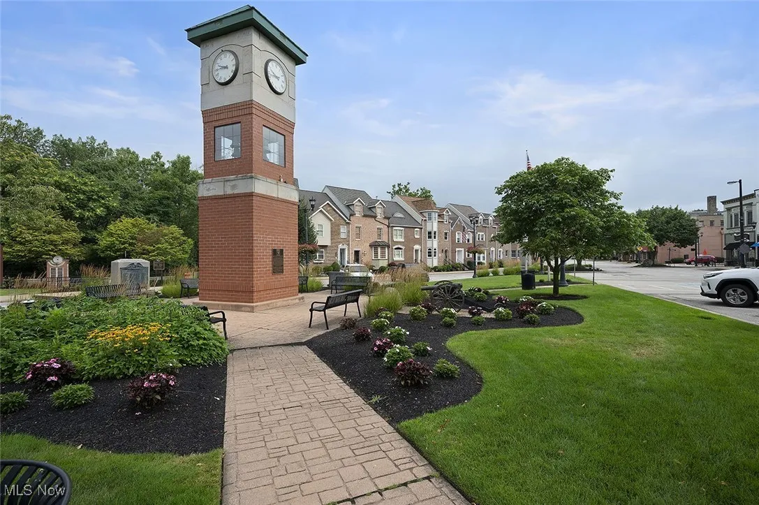View of community featuring a yard and a residential view