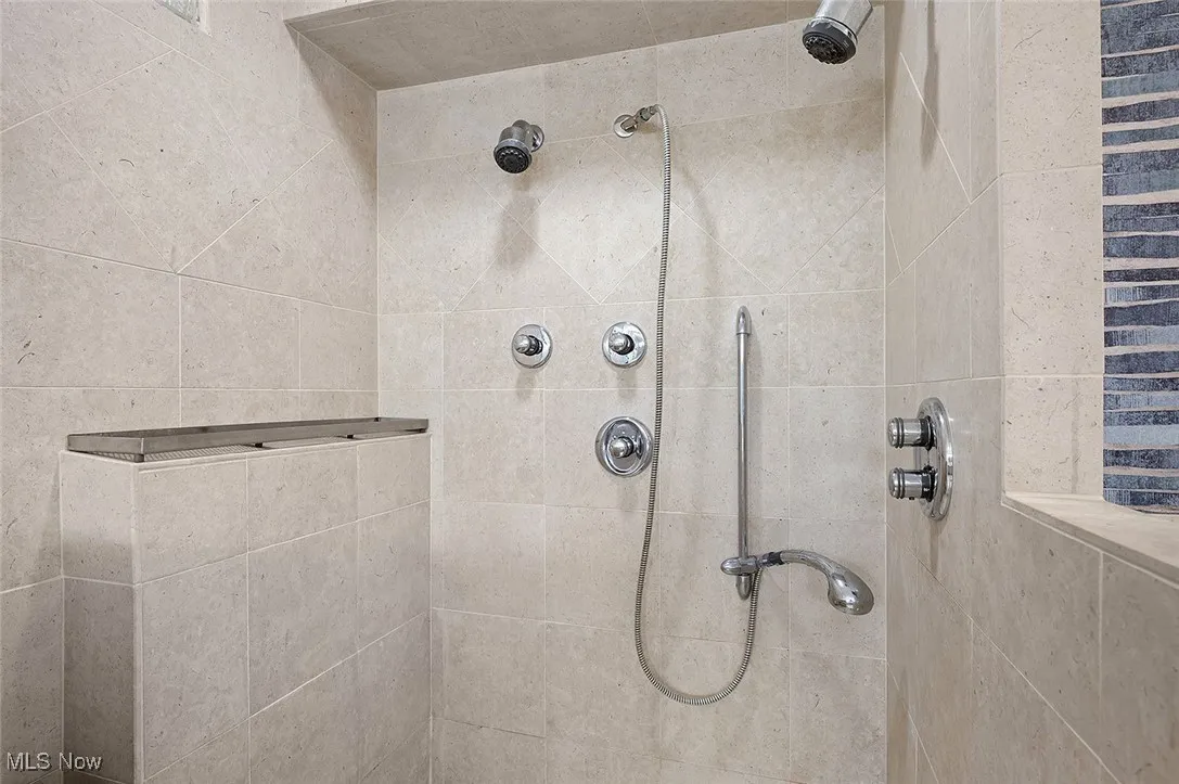 Full bathroom with tiled shower