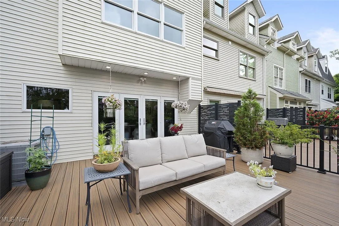 Deck featuring french doors, an outdoor hangout area, a grill, and a residential view