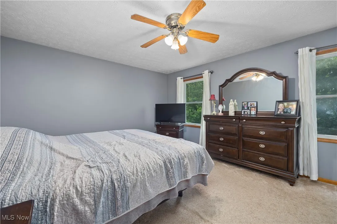 Master bedroom featuring 2 closets and full bathroom