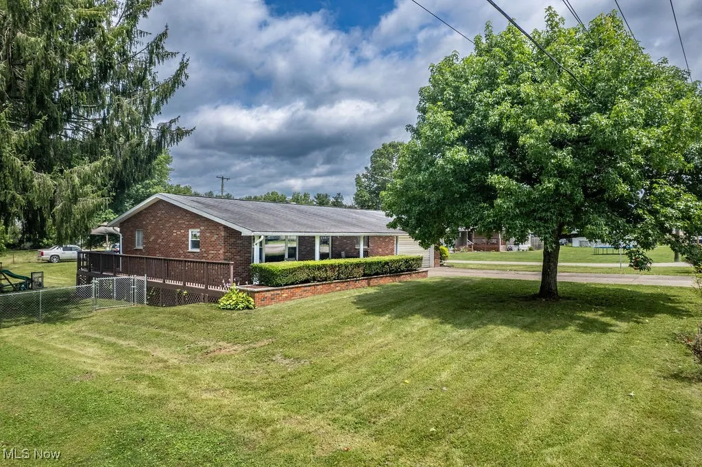 View of front of house with brick siding and a garage