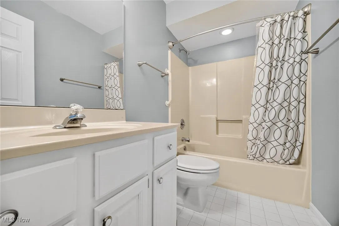 2nd floor Bathroom with shower / tub combo, vanity, and tile patterned floors