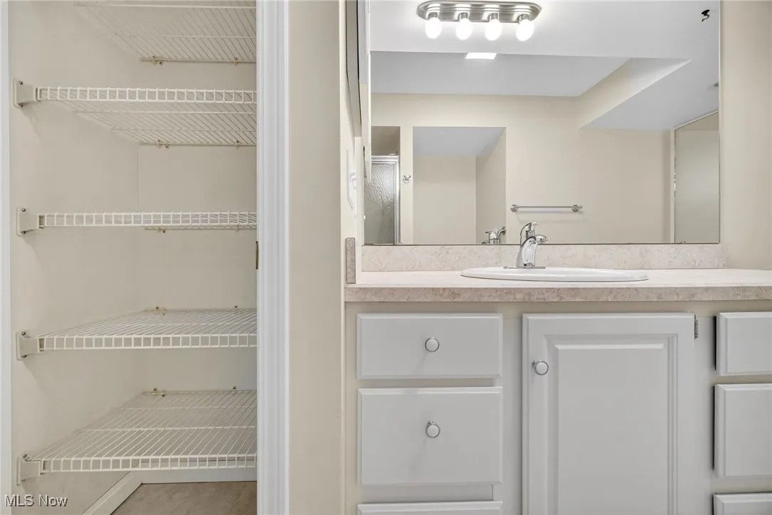 Full bathroom with vanity and a shower with shower door