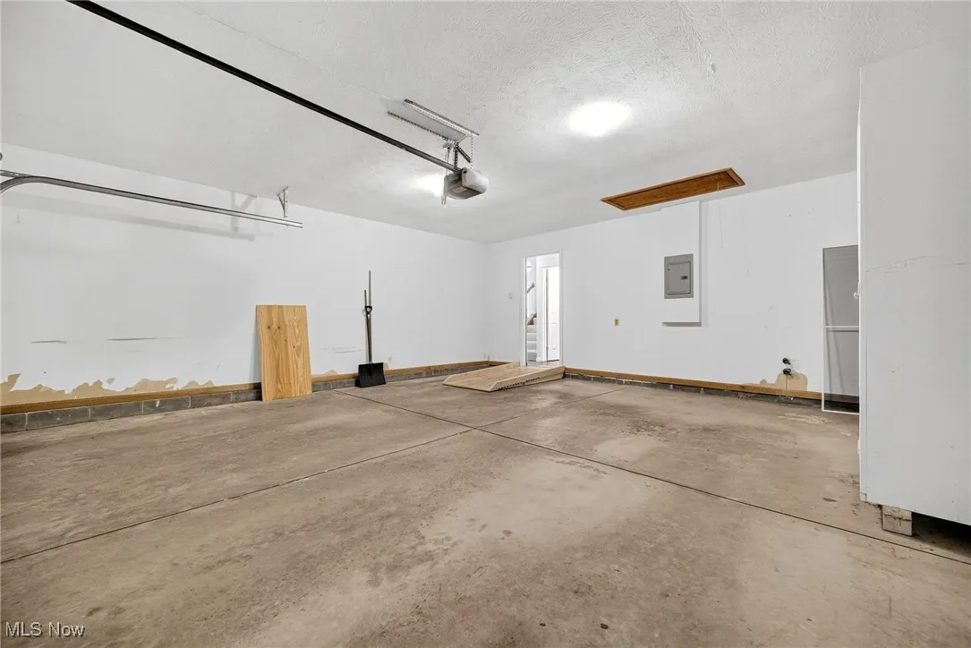 Garage door opener with one controller and a keypad.