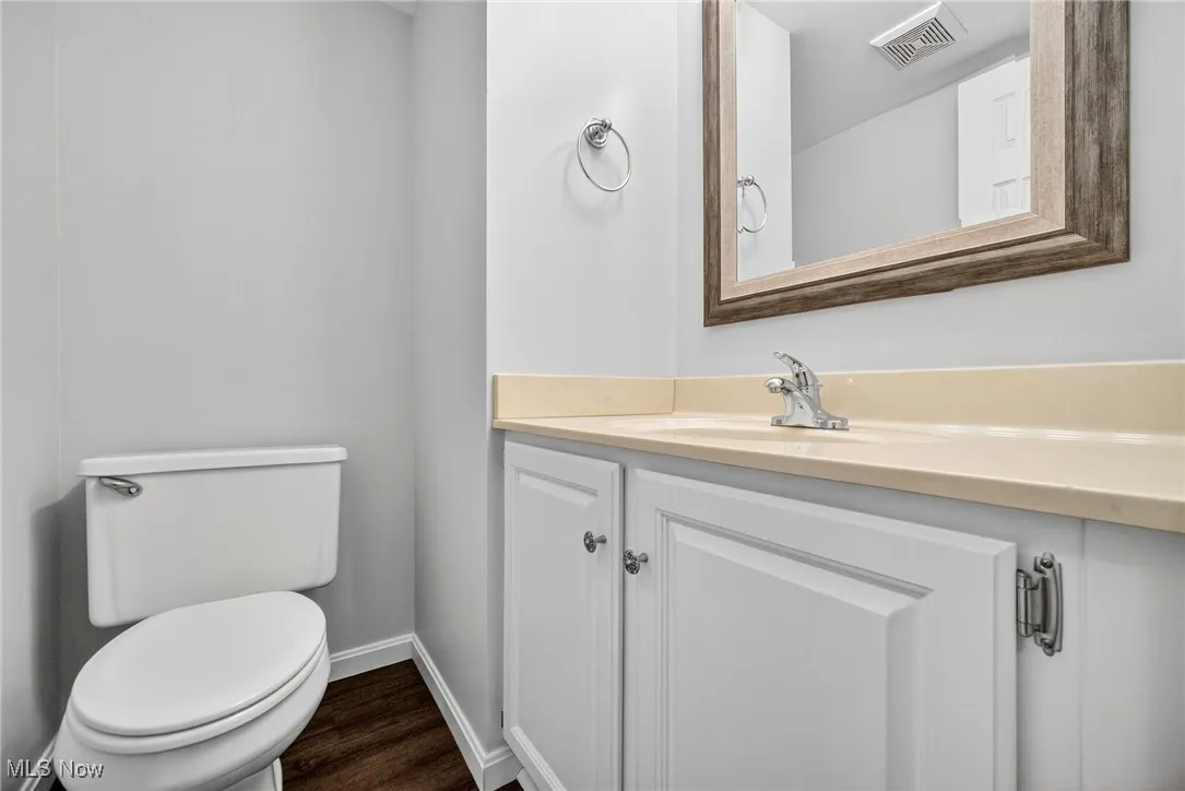 Bathroom featuring vanity and wood finished floors
