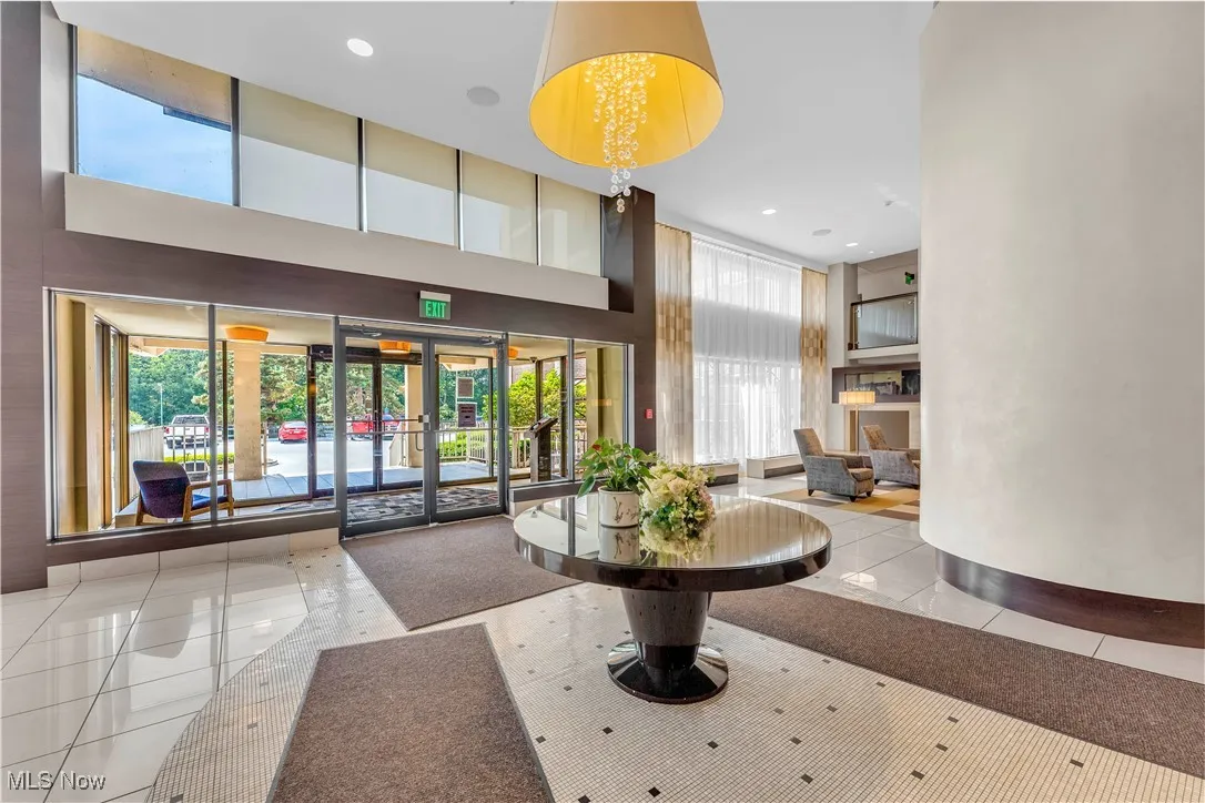 Community lobby with a towering ceiling and recessed lighting