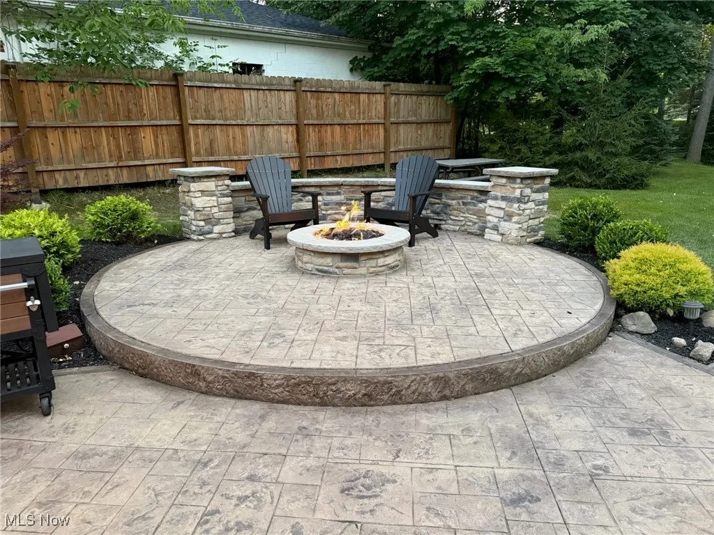 View of patio featuring a fire pit