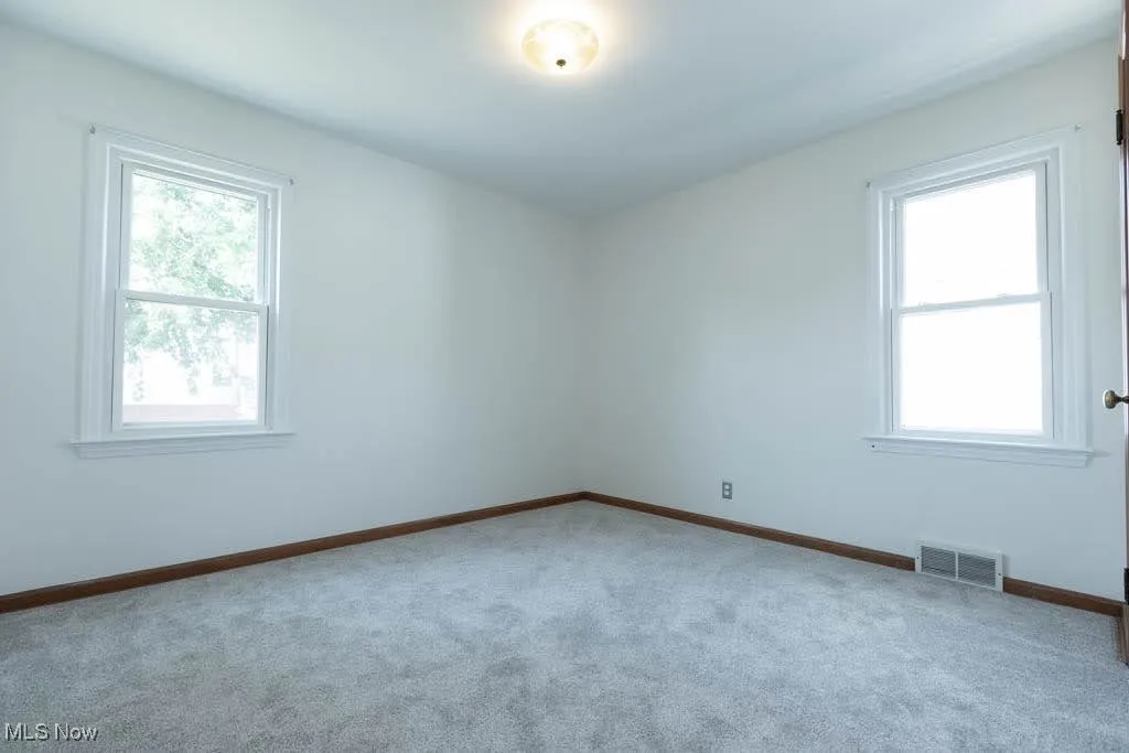 Spare room with carpet flooring