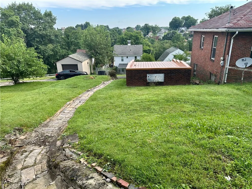 Backyard featuring a garage