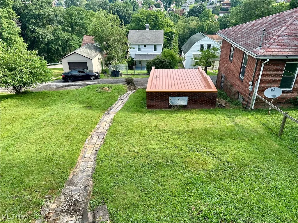 View of Yard from Rear Porch featuring a garage