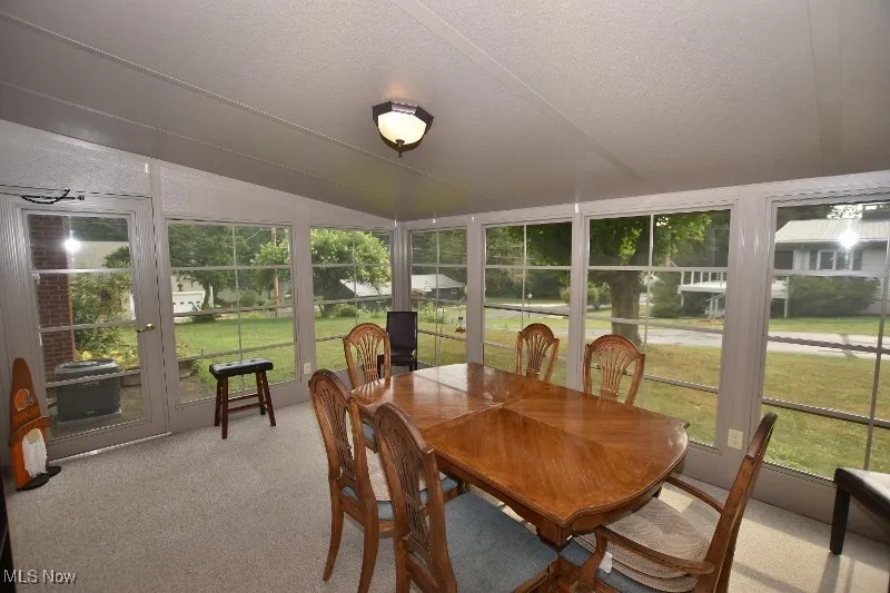 The lake view sunroom will be a huge hit for family and friends extending the outdoor living season!