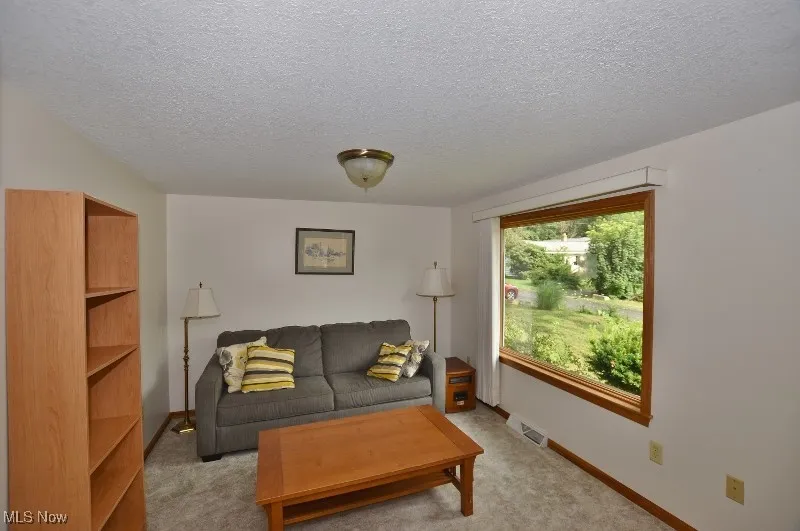 This second living area/ bonus room could easily be converted into a 3rd bedroom if desired