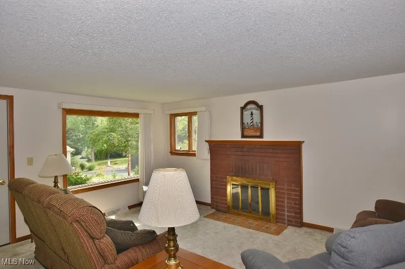 Limited summer season lake views from the living room and the enclosed porch