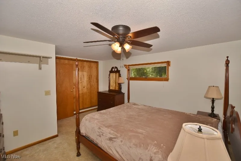 The primary bedroom is spacious with his and her closets