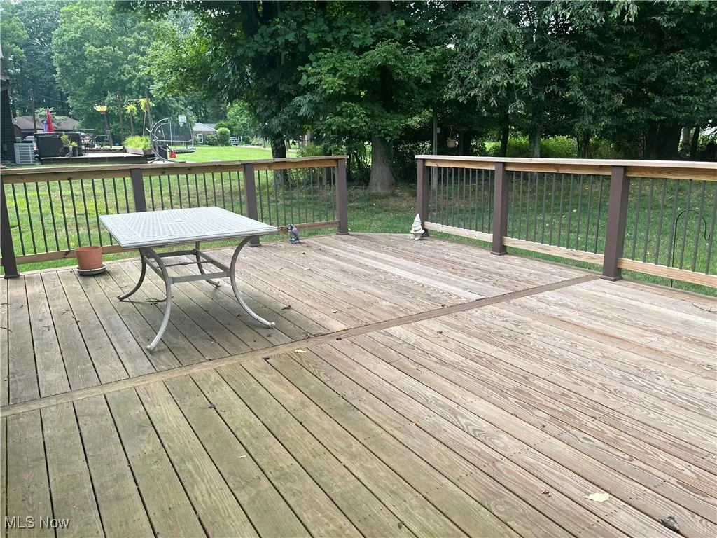 Wooden deck accessible from the kitchen and family room.