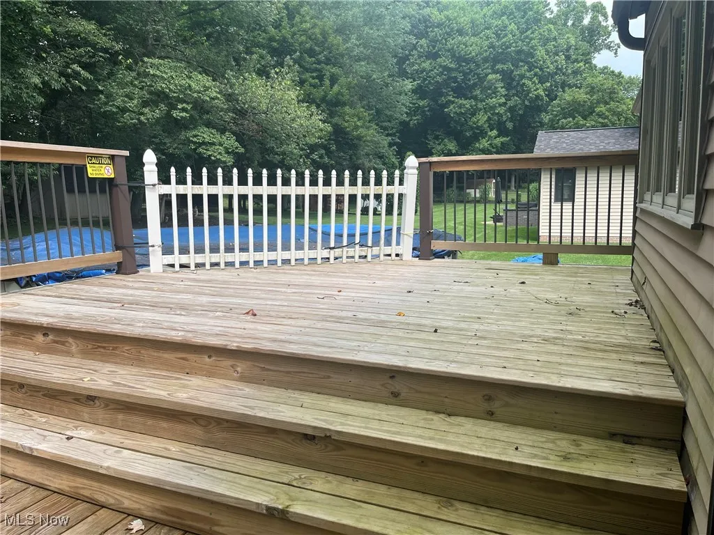 Second Tier of the Wooden Deck leads to the Above Ground Pool (which stays)