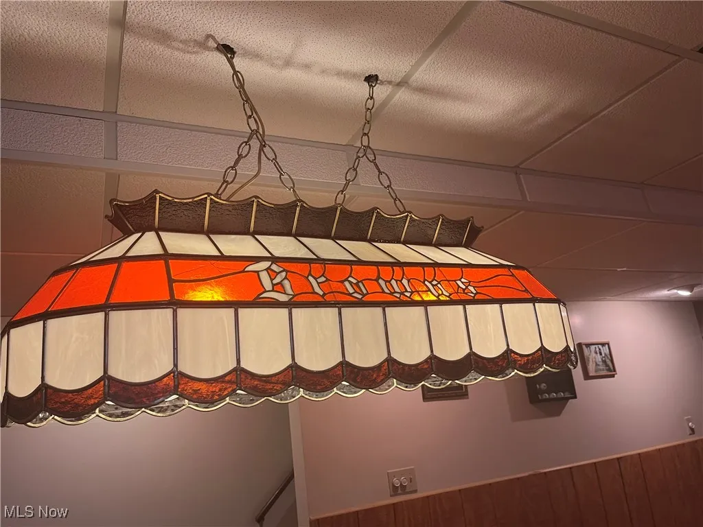 Cleveland Browns Tiffany Lamp over Pool Table also stays.