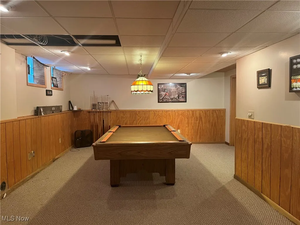 Recreation room is ready for entertaining or racking up the pool balls.