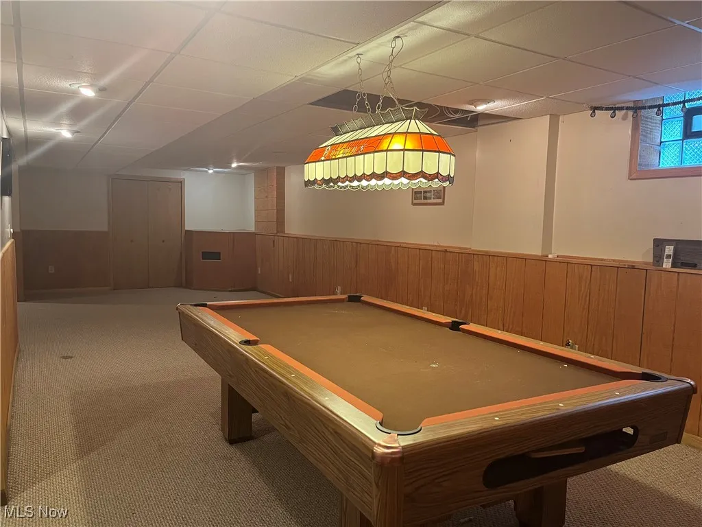 Finished Rec Room with a Pool Table that stays.
