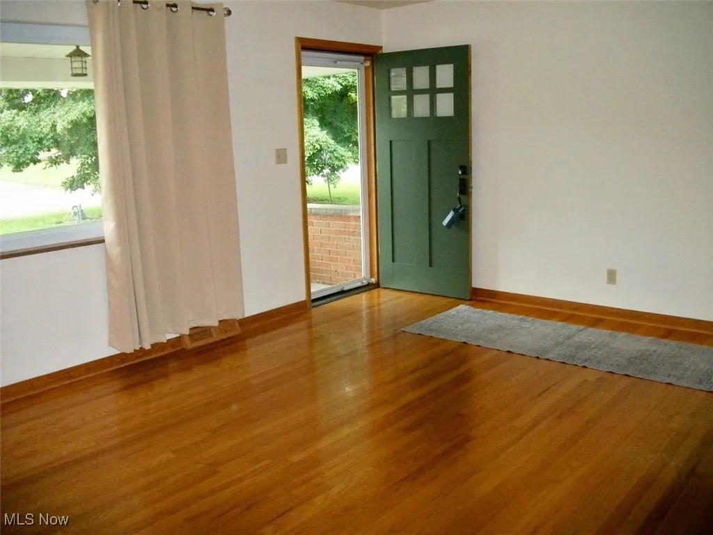  featuring wood finished floors and baseboards