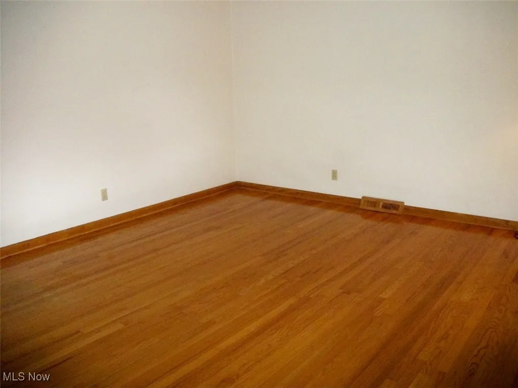  room with wood finished floors and baseboards