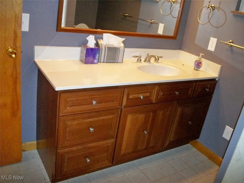 Bathroom with vanity and 6
