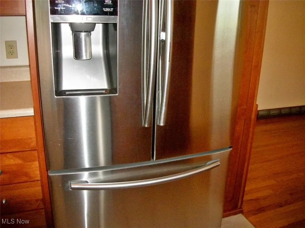 Kitchen view of freestanding refrigerator