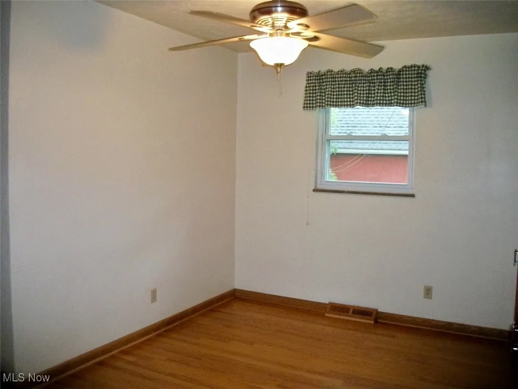 dining room featuring a ceiling fan and wood finished floors