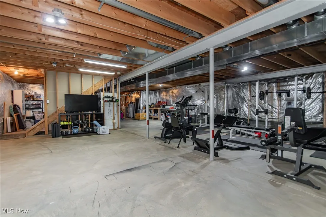 Unfinished lower level with built-in storage shelfs