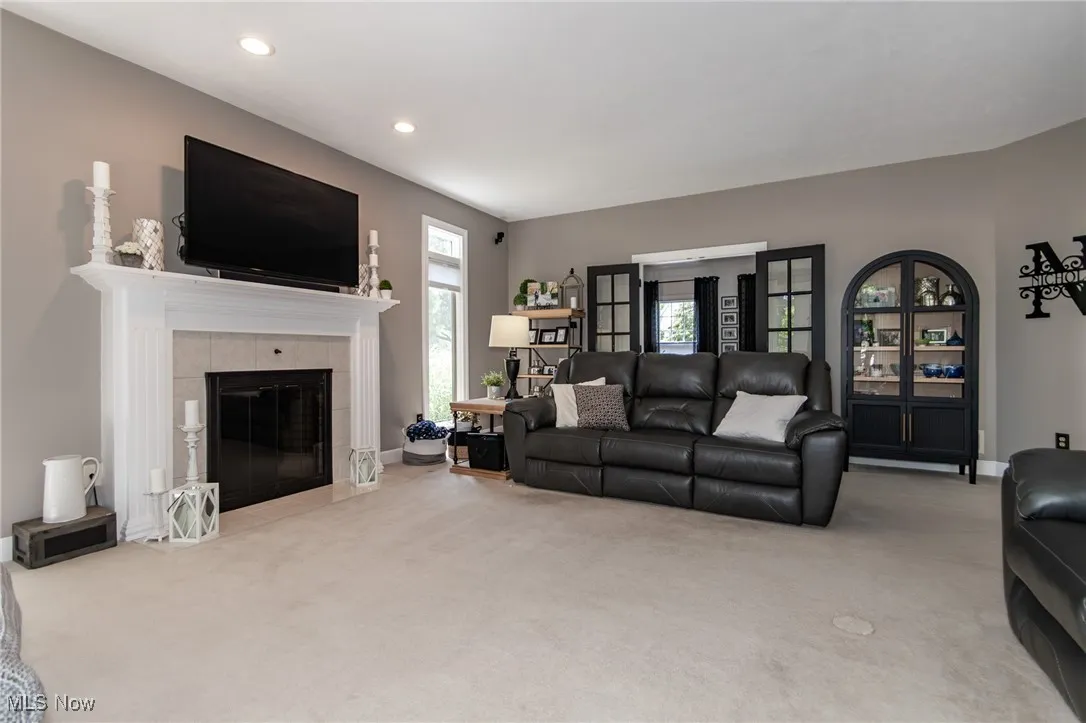 Carpeted Family Room with French Doors to the Living Room