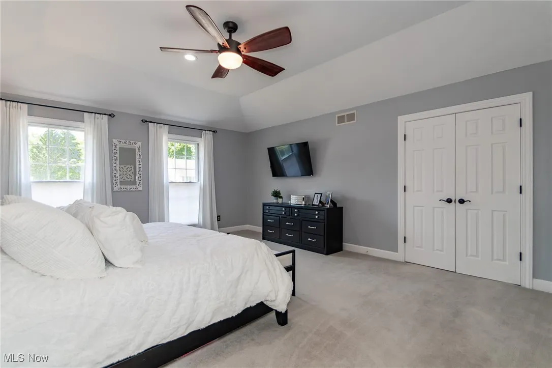 2nd floor Master Bedroom with double entry doors and an abundance of natural light
