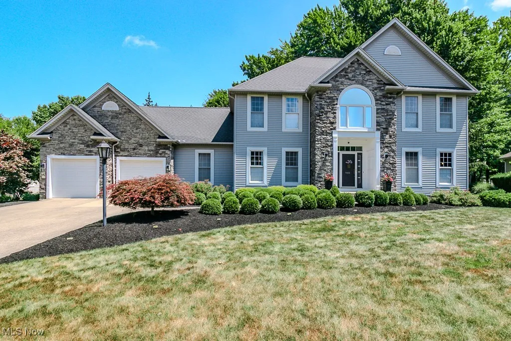 Beautiful Colonial style home with partial stone front, 2 car attached garage and fresh black mulch