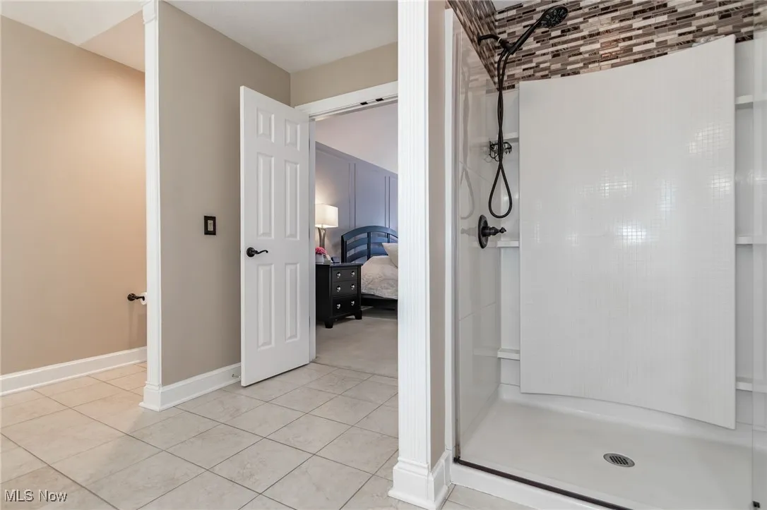 Walk-in shower stall with dual shower heads